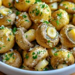 - 1 lb baby bella mushrooms, cleaned and stems trimmed - 3 tablespoons olive oil - 4 cloves garlic, minced - 1 teaspoon dried thyme - 1 teaspoon dried oregano - 1/2 cup grated Parmesan cheese - Salt and pepper to taste These main ingredients are key to making your Air Fryer Garlic Parmesan Mushrooms shine. Baby bella mushrooms give a rich and earthy flavor. Olive oil helps everything stick and adds a nice shine. Garlic brings a bold taste that pairs well with the cheese. Dried thyme and oregano add layers of flavor that balance the dish. Parmesan cheese adds a savory touch that makes these mushrooms irresistible. Salt and pepper are crucial for enhancing all the flavors. - 1/2 teaspoon crushed red pepper flakes - Fresh parsley, chopped (for garnish) You can spice things up with crushed red pepper flakes. They add a nice kick to the dish. Fresh parsley is perfect for garnish. It adds a pop of color and freshness. You can easily customize the dish to suit your taste with these simple additions. - Salt and pepper - Cooking oil variations Salt and pepper are your best friends in cooking. They help bring out the flavors in the mushrooms. You can use different oils if you prefer. Avocado oil or garlic-infused oil can add a unique twist. Just make sure to use enough oil for even cooking. First, start by cleaning the baby bella mushrooms. Rinse them gently under cold water. Use a soft cloth or paper towel to wipe off any dirt. Next, trim the stems so they are even. This helps them cook better. Now, preheat your air fryer to 375°F (190°C). Let it heat up for about 5 minutes. Preheating ensures even cooking and a nice, crispy texture. In a large bowl, combine the cleaned mushrooms with the olive oil. Add the minced garlic, dried thyme, and oregano. If you like a bit of heat, add the crushed red pepper flakes. Don’t forget to sprinkle in some salt and pepper. Toss the mushrooms well to coat them evenly. You want every mushroom to have that tasty mix on it. After that, sprinkle half of the grated Parmesan cheese over the mushrooms. Toss again until all mushrooms are covered. Place the mushrooms in a single layer in the air fryer basket. You may need to cook them in batches, depending on your air fryer's size. This helps them cook evenly. Air fry the mushrooms for 10 to 12 minutes. Shake the basket halfway through to ensure they cook on all sides. You’ll know they are done when they look golden and feel tender. Once cooked, transfer the mushrooms back to the bowl. Add the rest of the Parmesan cheese and toss gently. This final touch adds a cheesy flavor that you will love. Serve them warm and enjoy! To enhance your Air Fryer Garlic Parmesan Mushrooms, adjust spices to your taste. If you like heat, add more crushed red pepper flakes. For a milder dish, cut back on them. You can also swap in fresh herbs. Fresh thyme or parsley brings a vibrant taste. Experiment with different combinations to find your favorite mix. To achieve ideal tenderness, do not overcrowd the air fryer basket. Cook the mushrooms in a single layer. This allows hot air to circulate for even cooking. Check them halfway through and shake the basket. This helps them cook perfectly. To avoid sogginess, make sure to coat the mushrooms lightly with olive oil. Too much oil can lead to a mushy texture. These mushrooms pair well with many dishes. Serve them alongside grilled chicken or fish. They also complement a fresh salad. For garnishing, sprinkle extra Parmesan cheese on top. A few sprigs of fresh parsley will add color and flavor. You can also serve them with toothpicks as a fun appetizer. {{image_2}} You can swap the Parmesan cheese for other types. Try mozzarella for a stringy melt. Feta adds a tangy bite. For a richer flavor, go with aged cheddar. If you're vegan, use cashew cheese or nutritional yeast. Both give a cheesy taste without dairy. To change the taste, add other spices. A pinch of smoked paprika gives a nice kick. Try mixing in fresh herbs like basil or rosemary for added depth. You can also add bell peppers or spinach for more color and nutrition. These vegetables cook well and blend nicely with the mushrooms. If you don't have an air fryer, you can bake these mushrooms. Preheat your oven to 400°F (200°C). Spread the coated mushrooms on a baking sheet. Bake them for about 20 minutes. They should be golden and tender. You can also sauté them on the stovetop. Heat a pan over medium heat and add oil. Cook the mushrooms for about 8-10 minutes, stirring often, until they are soft and golden. Store leftover mushrooms in an airtight container. They stay fresh in the fridge for up to three days. If you want to keep them longer, freeze the mushrooms. Place them in a freezer-safe bag. Remove as much air as possible before sealing. They can last up to three months in the freezer. To reheat, use the air fryer for the best results. Set it to 350°F (175°C) and cook for about 5 minutes. This helps retain the mushrooms' texture. You can also use the microwave, but they may become soggy. If using the microwave, heat in short bursts and check often. These mushrooms last about three days in the fridge. If you see any dark spots or mold, toss them out. A bad smell is another sign they have spoiled. Always check before eating leftovers to stay safe. To clean baby bella mushrooms, use a damp paper towel. Wipe each mushroom gently. Avoid soaking them in water, as they can absorb moisture. Trim any tough stems before cooking. This keeps them fresh and tasty. Yes, you can use regular white mushrooms. They work well and taste great. Just follow the same steps in the recipe. You may notice a milder flavor, but they will still be delicious. These mushrooms pair well with many dishes. Try serving them with grilled chicken or steak. They also go great with pasta or a fresh salad. For a fun twist, add them to a sandwich or wrap. To keep mushrooms from getting soggy, do not overcrowd the air fryer. Cook them in a single layer. Make sure to shake the basket halfway through cooking. This helps them cook evenly and stay crisp. You can prep the mushrooms ahead of time. Clean and coat them with olive oil and spices. Store them in the fridge for a few hours or overnight. Just air fry them when you're ready to serve. This recipe brings together simple ingredients to create tasty garlic parmesan mushrooms. We explored the main ingredients, optional additions, and essential seasonings. You learned the cooking steps, helpful tips, and fun variations. Finally, we covered storage and reheating advice. Try these mushrooms as a side dish or snack. With these tips, you'll impress anyone at your table. Enjoy experimenting with flavors and sharing your tasty results!
