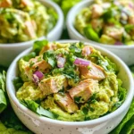 This Avocado Lime Tuna Salad has simple, fresh ingredients. Each one adds flavor and nutrition. Here’s what you need: - 2 cans of tuna in water, drained - 1 ripe avocado, mashed - 1/4 cup plain Greek yogurt - 2 tablespoons lime juice (freshly squeezed) - 1 small red onion, finely chopped - 1/2 cup celery, diced - 1/4 cup cilantro, chopped - 1/2 teaspoon garlic powder - Salt and pepper to taste - Mixed greens or lettuce leaves for serving Each ingredient plays a role in the salad's taste. The tuna gives protein. The avocado adds creaminess. Greek yogurt keeps it light and tangy. The lime juice brightens the flavors. Here’s how much of each ingredient you need: - Tuna: 2 cans (about 10 oz) - Avocado: 1 ripe - Greek yogurt: 1/4 cup - Lime juice: 2 tablespoons - Red onion: 1 small - Celery: 1/2 cup - Cilantro: 1/4 cup - Garlic powder: 1/2 teaspoon - Salt and pepper: to taste Fresh ingredients make a big difference. Use ripe avocados for creaminess. Choose high-quality tuna for the best flavor. Fresh lime juice is key for brightness. Always wash your veggies before use. When everything is fresh, your salad will taste amazing! {{ingredient_image_1}} To make this Avocado Lime Tuna Salad, start by gathering all your ingredients. This simple dish takes just 10 minutes to prepare. You will need tuna, avocado, Greek yogurt, lime juice, red onion, celery, cilantro, garlic powder, salt, and pepper. Freshness matters, so use ripe avocado and fresh lime juice for the best flavor. 1. Combine the base ingredients: In a large mixing bowl, add 2 cans of drained tuna, 1 ripe mashed avocado, and 1/4 cup of plain Greek yogurt. Stir these well until they blend smoothly together. 2. Add lime juice: Pour in 2 tablespoons of freshly squeezed lime juice. This keeps the avocado from browning and adds a zesty flavor to the mix. 3. Mix in veggies: Next, add 1 small finely chopped red onion, 1/2 cup of diced celery, and 1/4 cup of chopped cilantro into the bowl. Stir until everything is evenly mixed. 4. Season to taste: Sprinkle in 1/2 teaspoon of garlic powder. Add salt and pepper according to your taste. Mix everything until it all comes together nicely. You can serve the tuna salad on a bed of mixed greens or in lettuce wraps. If you want a more fun presentation, scoop the salad into avocado halves. Add extra cilantro and lime wedges for a beautiful touch. For even better flavor, chill the salad in the fridge for 30 minutes before serving. Enjoy your healthy and tasty meal! To keep the avocado from turning brown, use fresh lime juice. Lime juice slows the browning process. Mix it in right after you mash the avocado. If you have leftovers, cover the salad tightly with plastic wrap. Press the wrap directly onto the salad surface. This limits air exposure. This tuna salad pairs well with many foods. Serve it on mixed greens for a fresh crunch. You can also use lettuce wraps for a low-carb option. For a fun twist, add tortilla chips on the side. They add a nice crunch and flavor contrast. A light soup also complements this salad perfectly. You don’t need many tools for this easy recipe. Here’s what you need: - Large mixing bowl - Fork for mashing avocado - Spoon for mixing - Knife for chopping veggies - Measuring cups and spoons These simple tools make the process quick and easy. Enjoy making your Avocado Lime Tuna Salad! Pro Tips Choosing the Right Avocado: Make sure to select a ripe avocado that yields slightly to pressure for the best creaminess in your salad. Enhancing Freshness: For a zesty kick, consider adding some diced jalapeño or a dash of hot sauce to the mixture. Storing Leftovers: If you have leftovers, store the salad in an airtight container to maintain its freshness, and consume it within 1-2 days. Meal Prep Friendly: This tuna salad can be made in advance and stored in the fridge, making it a perfect option for meal prep or quick lunches. {{image_2}} You can easily swap out ingredients to make this salad even healthier. Here are some ideas: - Greek Yogurt: Use low-fat Greek yogurt instead of regular for fewer calories. - Avocado: If you want less fat, try half an avocado and add more Greek yogurt. - Tuna: Choose tuna packed in water instead of oil to cut extra fat. - Salt: Use low-sodium salt to reduce sodium intake without losing flavor. These small changes can make a big difference in health! You can add extra flavors to your salad to mix things up. Here are some tasty ideas: - Spices: Add chili powder for a kick or smoked paprika for depth. - Veggies: Toss in diced bell peppers or shredded carrots for added crunch. - Fruits: Try adding diced mango or pineapple for a sweet touch. - Nuts: Chopped walnuts or almonds can add a nice texture and healthy fats. Feel free to experiment and find what you love! How you serve your tuna salad can change the experience. Here are some fun serving ideas: - Lettuce Wraps: Use large lettuce leaves to make fresh wraps. - Stuffed Avocados: Scoop out some avocado halves and fill them with the salad. - On Toast: Spread the salad on whole-grain toast for a quick meal. - With Crackers: Serve it with whole-grain crackers for a crunchy snack. Try these styles for a new twist on a classic dish! To keep your Avocado Lime Tuna Salad fresh, store it in an airtight container. Place it in the fridge right after making it. This helps maintain its taste and texture. The salad stays good for about 2 days. If you notice any browning on the avocado, you can mix it again. This re-blends the flavors and helps hide any brown spots. Always check for any strange smells before eating leftovers. Freezing this salad is not the best idea. The avocado does not freeze well. It changes texture when thawed. If you need to freeze it, leave out the avocado and add it later. You can freeze the tuna mixture in a container. It lasts up to 3 months in the freezer. When ready to eat, thaw it in the fridge overnight. Then, add fresh avocado before serving. You do not really need to reheat this salad. It tastes great cold. If you prefer warm tuna, heat it gently on the stove. Use low heat to avoid overcooking it. Stir it often to keep it from sticking. Once warm, mix it with the avocado and other ingredients. Serve it right away for the best taste. Yes, you can use canned tuna in oil. The oil adds extra flavor and richness. However, it may also make the salad a bit heavier. If you prefer a lighter dish, stick with tuna in water. The choice is yours based on your taste! This salad lasts about 2-3 days in the fridge. Make sure to store it in an airtight container. After a day, the avocado may brown a bit. You can add more lime juice to help keep it fresh. Avocado Lime Tuna Salad is packed with nutrients. Here are some benefits: - Tuna: High in protein and omega-3 fatty acids, great for heart health. - Avocado: Offers healthy fats, fiber, and vitamins like E and K. - Greek yogurt: Adds protein and probiotics for gut health. - Veggies: Celery and onion give fiber and essential vitamins. This salad is not only tasty but also great for your health! In this post, we covered key ingredients, step-by-step instructions, and helpful tips for making delicious Tuna Salad. We explored variations and best storage practices to keep it fresh. Remember, quality ingredients and proper preparation make a big difference. Experiment with flavors to find your favorite mix. With these insights, you can make a tuna salad that’s tasty and nutritious. Enjoy making your perfect dish!