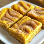 To make these tasty pumpkin spice snickerdoodle bars, gather the following items: - 1 cup unsalted butter, softened - 1 cup granulated sugar - 1 cup packed brown sugar - 2 large eggs - 1 teaspoon vanilla extract - 2 cups all-purpose flour - 2 teaspoons cream of tartar - 1 teaspoon baking soda - 1 teaspoon pumpkin pie spice - ½ teaspoon salt - ½ cup granulated sugar (for rolling) - 1 tablespoon ground cinnamon (for rolling) You can make easy swaps if you need to. Use coconut oil instead of butter. For eggs, use applesauce. You can use gluten-free flour if you want a gluten-free option. Just keep the same amounts. To keep your bars fresh, store them in an airtight container. This helps keep moisture in, so they stay soft. If you add cream cheese frosting on top, eat them within a few days. You can also freeze these bars. Wrap them tightly in plastic wrap before placing them in a freezer bag. They will stay fresh for up to three months. 1. Start by preheating your oven to 350°F (175°C). Grease a 9x13 inch baking pan. 2. In a large bowl, cream together 1 cup of softened butter, 1 cup of granulated sugar, and 1 cup of brown sugar. Mix until it's light and fluffy. 3. Add 2 large eggs, one at a time. Mix well after each addition. Then, stir in 1 teaspoon of vanilla extract. 4. In another bowl, whisk together 2 cups of all-purpose flour, 2 teaspoons of cream of tartar, 1 teaspoon of baking soda, 1 teaspoon of pumpkin pie spice, and ½ teaspoon of salt. 5. Gradually add the dry mix to the butter mix. Stir until you have a soft dough. - Use room temperature butter for better mixing. - Avoid over-mixing the dough. This keeps your bars soft. - For a nice texture, make sure your baking pan is greased well. - Keep an eye on the oven. Bake for 25-30 minutes. Check with a toothpick. It should come out clean. - After baking, let the bars cool in the pan for about 10 minutes. - Then, transfer them to a cutting board to cool completely. - Cut into squares for serving. - For a special touch, dust with pumpkin pie spice before serving. - Pair with vanilla ice cream for a cozy fall treat! When making pumpkin spice snickerdoodle bars, avoid overmixing the dough. Overmixing can make the bars tough. Be gentle when adding dry ingredients to the wet mix. Also, measure your flour correctly. Too much flour can lead to dry bars. Use a spoon to scoop the flour into a measuring cup, then level it off. For soft and chewy bars, make sure your butter is just softened, not melted. Mix the sugars with the butter until light and fluffy. This adds air, which helps the bars rise. When spreading the dough in the pan, don’t press it down too hard. This will keep them soft and tender. To boost the flavor, try adding a pinch of nutmeg or ginger to the dough. You can also mix in chocolate chips or nuts for extra texture. For a pretty finish, dust the bars with more pumpkin pie spice. Serve them warm with a scoop of vanilla ice cream for a real treat. A decorative platter makes them look festive for fall gatherings. {{image_2}} To make these bars gluten-free, swap all-purpose flour with a gluten-free blend. Look for a mix that contains xanthan gum. This helps mimic the texture of wheat flour. You can also use almond flour or oat flour. Both options will add a nice flavor twist. Just keep in mind that the texture may change a bit. For a dairy-free version, use vegan butter instead of regular butter. This simple swap keeps the bars rich and tasty. Also, replace eggs with flax eggs or applesauce. To make a flax egg, mix 1 tablespoon of ground flaxseed with 2.5 tablespoons of water. Let it sit for five minutes to thicken. This keeps your bars moist and fluffy. Want to add your own spin? Try mixing in chocolate chips or nuts. Chopped pecans or walnuts add great texture. You could also add a splash of maple syrup for extra sweetness. For a spicier kick, increase the pumpkin pie spice. You can even add a hint of orange zest for a citrus touch. These small tweaks can create a unique flavor profile. To keep your pumpkin spice snickerdoodle bars fresh, store them in an airtight container. This helps keep moisture in and avoids drying out the bars. You can keep them at room temperature for up to three days. If you want to store them longer, consider refrigeration. Freezing is a great way to save your bars for later. First, let the bars cool completely. Then, cut them into squares. Wrap each square in plastic wrap, and place them in a freezer bag. You can freeze them for up to three months. When you're ready to enjoy, just thaw them in the fridge overnight. If you want to enjoy warm bars, reheating is easy. Place a square in the microwave for about 15-20 seconds. This warms it up just right. You can also use an oven. Preheat to 350°F (175°C), and heat the bars for about 5-10 minutes. Enjoy them warm with a scoop of ice cream for a treat! Yes, you can make these bars ahead of time. They taste great even after a day. Just store them in an airtight container. Keep them at room temperature for the best flavor. If you want to bake them later, you can chill the dough. Just remember to let it warm up before baking. To check if the bars are done, look for a golden color. Insert a toothpick in the center. If it comes out clean, the bars are ready. If not, bake them a few more minutes. Keep an eye on them to avoid overbaking. For clean cuts, let the bars cool completely. Use a sharp knife for best results. Lightly score the top before cutting into squares. This makes it easier to slice. You can also use a ruler to measure equal pieces if you like. Enjoy your perfectly cut Pumpkin Spice Snickerdoodle Bars! This blog post covered the key steps to making delicious pumpkin spice snickerdoodle bars. We talked about the right ingredients, how to prepare and bake them, and tips to avoid mistakes. You learned about storage options and how to customize flavors. These bars are easy to make and fun to share. With a few simple tips, you can create a treat everyone will love. Enjoy baking your tasty bars!