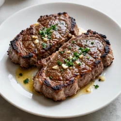 - 2 ribeye steaks (about 1 inch thick) - 4 tablespoons unsalted butter - 4 cloves garlic, minced - 2 teaspoons fresh rosemary, chopped - 2 teaspoons fresh thyme, chopped - Salt and pepper to taste - 1 tablespoon olive oil - Fresh parsley for garnish When you make this Garlic Butter Herb Steak Skillet, you need the best ingredients. Ribeye steaks are juicy and flavorful. They shine in this dish. Use unsalted butter to control the salt. Garlic adds a rich, aromatic taste that elevates the steak. Fresh herbs like rosemary and thyme bring a garden-fresh touch. They pair well with the beef. Don't forget salt and pepper. They enhance all the flavors. If you want a bit of extra flavor, add olive oil. It helps with the searing process. You can also use fresh parsley to make the dish look nice. It adds a pop of color to your plate. Gather your ingredients before you start. This makes cooking easier and more fun. With these simple items, you can create a meal that impresses everyone! {{ingredient_image_1}} First, season both sides of the ribeye steaks with salt and pepper. You want a nice, even layer. This step adds flavor and helps form a crust. Next, let the steaks sit at room temperature for about 30 minutes. This helps the meat cook evenly. It also makes the steak more tender and juicy. Now it’s time to heat the skillet. Use a large cast-iron skillet or a heavy pan. Heat the olive oil over medium-high heat until it shimmers. This means it’s hot enough for searing. Add the seasoned ribeye steaks to the skillet. Sear each side for about 4-5 minutes for a medium-rare steak. Flip the steaks only once. This helps them form a great crust without losing juices. Adjust the cooking time if you want a different doneness. When the steaks are nearly done, reduce the heat to medium-low. Add the butter, minced garlic, rosemary, and thyme to the skillet. Spoon the melted butter over the steaks. Do this for about 1-2 minutes. This adds rich flavor and keeps the meat moist. After that, remove the skillet from heat. Transfer the steaks to a plate and cover them loosely with aluminum foil. Let them rest for about 5-10 minutes. This lets the juices redistribute, making every bite juicy and tasty. Using a meat thermometer helps ensure your steak is cooked just right. For medium-rare, aim for 130°F to 135°F. Insert the thermometer into the thickest part of the steak for an accurate reading. Adjust cooking time based on steak thickness. A thicker steak needs more time, while a thinner steak cooks faster. Generally, a 1-inch ribeye takes about 4-5 minutes per side for medium-rare. Choosing the right herbs makes a big difference. Fresh rosemary and thyme add depth to the garlic butter. You can also try herbs like oregano or sage for a twist. Consider marinating your steak before cooking. A simple mix of olive oil, garlic, and herbs can boost flavor. Allow the steak to marinate for at least 30 minutes or up to 2 hours for best results. Pair your steak with great side dishes. A fresh garden salad or roasted vegetables complement the rich flavors. Mashed potatoes or creamy polenta also work well. For a beautiful plate, slice the steak against the grain. Spoon some of the garlic butter over the slices. Garnish with fresh parsley for a pop of color and freshness. Pro Tips Rest Your Steak: Allowing the steak to rest after cooking is crucial for juicy results. It helps the juices redistribute, preventing them from running out when you cut into the meat. Use a Meat Thermometer: For perfect doneness, use a meat thermometer. Aim for 130°F for medium-rare, and adjust cooking time accordingly to achieve your desired level of doneness. Don’t Overcrowd the Skillet: Cook one or two steaks at a time to ensure even cooking and a good sear. Overcrowding can lower the temperature of the pan and lead to steaming instead of searing. Choose Quality Ingredients: Opt for high-quality ribeye steaks and fresh herbs. The flavor and tenderness of the steak will significantly impact the overall taste of the dish. {{image_2}} You can switch up the cuts of steak you use. Filet mignon is a great choice. It is tender and melts in your mouth. Sirloin is another option that works well. It has a nice flavor and is often more affordable. Both cuts cook nicely in the skillet and absorb the garlic butter flavor. If you want to change the herbs, you have options. Fresh oregano adds a bright taste. Basil brings a sweet note that pairs well with steak. You can also try parsley for a fresh twist. Just remember to adjust the amount, as some herbs are stronger than others. You can cook your steak in different ways. Grilling gives it a smoky flavor. It’s perfect for summer BBQs. Skillet cooking is quick and keeps the steak juicy. You can also finish it in the oven for even cooking. This method is great for thick cuts. Just sear the steak first, then transfer it to a preheated oven to reach your desired doneness. To keep your leftovers fresh, let them cool first. Once cool, wrap the steak tightly in plastic wrap or place it in an airtight container. Store it in the fridge for up to three days. This keeps the steak juicy and full of flavor. If you have garlic butter left, store it separately in a small container. You can use it later to enhance the steak's taste. If you want to save the steak for later, freezing is the best option. First, let the cooked steak cool completely. Wrap it tightly in plastic wrap, followed by aluminum foil. This method prevents freezer burn. Label the package with the date. You can freeze the steak for up to three months. When you’re ready to eat, thaw it in the fridge overnight. Reheating steak can be tricky. You want to keep it tasty and tender. The best way is to use the oven. Preheat your oven to 250°F (120°C). Place the steak on a baking sheet. Heat it until warm, about 20-30 minutes. If you have garlic butter, melt it in a pan. After the steak warms up, drizzle the melted butter over it for extra flavor. You can also use a skillet on low heat, but be careful not to overcook it. This keeps the steak juicy and rich. Ribeye steaks are great for skillet cooking. Their fat content keeps them juicy. You can also use strip steak or sirloin. These cuts sear well and have great flavor. Filet mignon is tender but less flavorful. Choose a cut that fits your taste and budget. Yes, you can use dried herbs! Dried herbs pack a stronger flavor. Use one-third of the amount when swapping. For example, if the recipe calls for one tablespoon of fresh rosemary, use one teaspoon of dried. This keeps the taste balanced and tasty. To check steak doneness, look for color and firmness. Medium-rare steak is warm and red inside. Use a meat thermometer for best results. Aim for 130°F to 135°F for medium-rare. Let the steak rest for a few minutes after cooking. This helps keep the juices in. This blog post covered how to cook a delicious ribeye steak. We explored main ingredients like butter and garlic, along with the right herbs and seasonings. I shared clear steps for preparing and cooking your steak to perfection. You also got tips on doneness, flavor enhancement, and serving ideas. Remember, variations exist based on cuts and herbs, giving you freedom to explore. Storing and reheating your steak properly keeps it tasty. Enjoy cooking and savoring every bite of your steak!