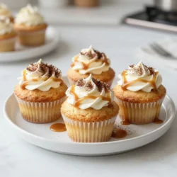 - 1 ½ cups all-purpose flour - 1 cup granulated sugar - ½ cup unsalted butter, softened - 2 large eggs - 1 cup brewed coffee, cooled - 1 teaspoon vanilla extract - 1 teaspoon baking powder - ½ teaspoon baking soda - ½ teaspoon salt - ½ cup caramel sauce (plus more for drizzling) - 1 cup heavy whipping cream - 2 tablespoons powdered sugar - 2 tablespoons instant coffee granules (optional) These ingredients create a rich and tasty cupcake. The brewed coffee gives it a bold flavor. The softened butter makes the batter smooth and creamy. - 2 tablespoons instant coffee granules - A pinch of cocoa powder for decoration - Chocolate shavings or sprinkles for topping Adding instant coffee boosts the coffee flavor. Cocoa powder adds a nice touch on top. This gives your cupcakes a lovely look. - 12-cup muffin tin - Cupcake liners - Mixing bowls (large and medium) - Whisk or electric mixer - Measuring cups and spoons - Toothpicks for testing - Cooling rack Using the right tools helps make baking easy. A muffin tin with liners keeps cupcakes from sticking. Having everything ready saves time and makes baking fun! {{ingredient_image_1}} First, preheat your oven to 350°F (175°C). This makes sure your cupcakes bake evenly. Next, line a 12-cup muffin tin with cupcake liners. This step helps with easy removal later. In a large mixing bowl, cream together ½ cup of softened butter and 1 cup of granulated sugar. Mix until it looks light and fluffy. Add 2 large eggs, one at a time. Stir well after each egg. Then add 1 teaspoon of vanilla extract and 1 cup of cooled brewed coffee. If you want more coffee flavor, mix in 2 tablespoons of instant coffee granules until they dissolve. In another bowl, whisk together 1 ½ cups of all-purpose flour, 1 teaspoon of baking powder, ½ teaspoon of baking soda, and ½ teaspoon of salt. Gradually add these dry ingredients to your wet mixture. Mix just until combined. Be careful not to over-mix; this keeps your cupcakes light. Gently fold in ½ cup of caramel sauce into the batter. This adds a sweet touch. Spoon the batter into the cupcake liners, filling each about 2/3 full. Bake in the preheated oven for 18-20 minutes. Check if they’re done by inserting a toothpick. If it comes out clean, they are ready. Let them cool in the tin for 5 minutes. Then, transfer them to a wire rack to cool completely. For the whipped cream, beat 1 cup of heavy whipping cream and 2 tablespoons of powdered sugar in a bowl. Mix until stiff peaks form. This means the cream holds its shape well. Frost the cooled cupcakes with the whipped cream. To finish, drizzle more caramel sauce on top for a lovely look. To make your cupcakes moist, use the right butter. Softened unsalted butter works best. Cream it well with sugar until fluffy. This helps trap air, giving your cupcakes a light texture. Adding cooled brewed coffee also adds moisture and enhances flavor. Remember to measure your flour correctly. Too much flour can dry out your batter. Gently fold in the caramel sauce for extra moisture and sweetness. Start with cold heavy whipping cream. It whips better when cold. Use a clean bowl and beaters for the best results. Add powdered sugar for a touch of sweetness. Beat until stiff peaks form. Be careful not to over-whip. Over-whipped cream can turn buttery. If you want a stronger coffee flavor, mix in a bit of instant coffee granules into the cream. This adds a lovely depth to your topping. Serve your cupcakes on a pretty plate. A small decorative touch always impresses. Drizzle extra caramel sauce on top for a sweet finish. You can also sprinkle cocoa powder or instant coffee granules for a nice contrast. Pair your cupcakes with a hot cup of coffee. This makes for a delightful treat! Pro Tips Use Strong Coffee: Opt for a strong brew to enhance the coffee flavor in your cupcakes. Cold brew or espresso can also add depth. Perfect Whipped Cream: Ensure your heavy cream is very cold before whipping to achieve the best volume and stability for your frosting. Caramel Sauce Choices: Choose a high-quality caramel sauce for drizzling to elevate the flavor. You can also make homemade caramel for a gourmet touch. Storage Tips: Store cupcakes in an airtight container at room temperature for up to 2 days, or refrigerate for longer freshness, but allow them to come to room temperature before serving. {{image_2}} You can change the flavor of your caramel latte cupcakes easily. Try adding chocolate. Mix in cocoa powder with the flour for a mocha twist. Or, use hazelnut coffee instead of regular brewed coffee. This adds a nutty flavor that pairs well with caramel. For a spicier version, add a pinch of cinnamon or nutmeg to the batter. You can also use vanilla bean paste instead of extract for a richer taste. While whipped cream is delightful, you can try other frostings too. A cream cheese frosting adds tanginess that balances the sweetness. For a decadent touch, use chocolate ganache. Just melt chocolate with cream and let it cool until it thickens. You can also try a buttercream frosting with caramel mixed in. This will give a creamy, sweet topping that enhances the cupcake's flavor. Presentation matters! Top your cupcakes with fun garnishes. A sprinkle of sea salt adds a nice contrast to the sweet caramel. You can also use chocolate shavings for a fancy look. For a fun twist, add mini coffee beans on top. Drizzling extra caramel sauce will make them look even tastier. Serve on a stylish plate with a warm cup of coffee for a complete experience. To keep your Caramel Latte Cupcakes fresh, store them in an airtight container. This helps retain moisture and flavor. Place the container at room temperature for up to three days. If you live in a hot and humid area, the fridge is better. Just remember to let them sit at room temperature before serving. Freezing is a great option if you want to save some cupcakes for later. First, let them cool completely. Next, wrap each cupcake tightly in plastic wrap. Then, place them in a freezer-safe bag or container. They can last in the freezer for up to three months. Just thaw them in the fridge overnight before enjoying. Caramel Latte Cupcakes stay fresh for about three days at room temperature. In the fridge, they can last up to a week. To reheat, place them in the microwave for about 10-15 seconds. This warms them up without drying them out. If you want to enjoy them warm, serve with a drizzle of fresh caramel sauce. To make these cupcakes gluten-free, swap all-purpose flour with a gluten-free blend. Look for a blend that works for baking. This will ensure the right texture and taste. Be sure to check that all other ingredients are also gluten-free. Yes, you can use different frostings. Cream cheese or chocolate frosting works well with these cupcakes. You could also try a buttercream or even a ganache for a rich taste. Each frosting will give a unique flavor twist to your treats. If you want to avoid coffee, use brewed tea or a coffee substitute. You can use chai tea for spice or hot cocoa for chocolate flavor. Just keep the liquid measurements the same for best results. To enhance the coffee flavor, add more brewed coffee or use instant coffee granules. Mixing in an extra tablespoon of instant coffee will boost that flavor without changing the cupcake's texture. Just dissolve it fully in hot water before adding it to the batter. You now have all the tools to make delicious caramel latte cupcakes. We covered the essential ingredients and tools needed for baking. You learned step-by-step how to mix, bake, and top your cupcakes. Plus, we shared tips for moist cupcakes and serving ideas. Remember, variations can change the flavors for new experiences. Store your cupcakes well and enjoy them longer. With practice, you can create treats everyone will love. Bake your next batch and impress your friends!